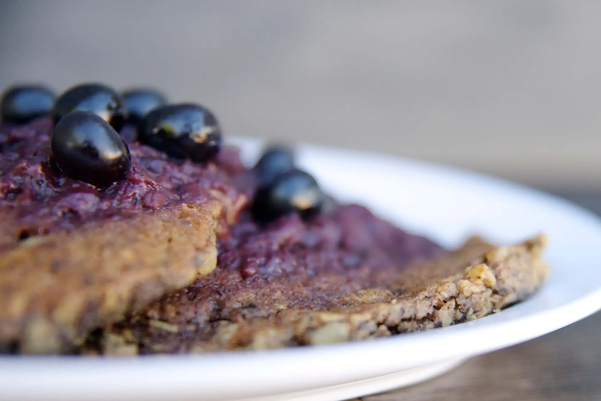 Oat Nut Pancakes with Fruit Compote salad At The Living Root Cafe - Vegan Restauran